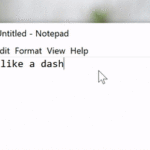 GIF of text being typed into Notepad. The text reads "I'd like a dash" followed by two hyphens that automatically convert to an em dash.